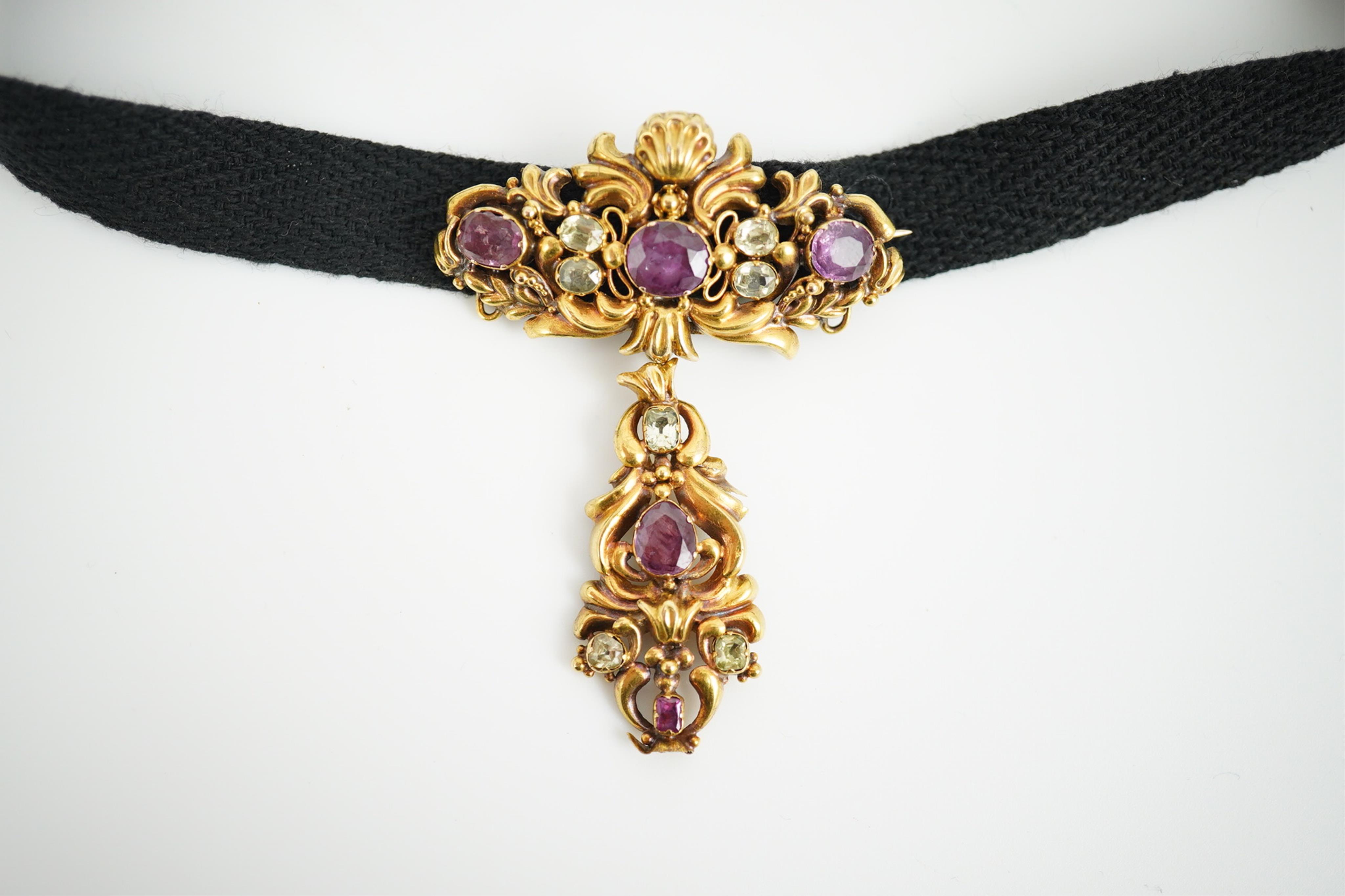 A Victorian yellow metal, garnet and chrysoberyl cluster set drop brooch, 56mm, on a black sash necklet